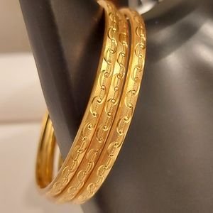 Set of 3 gold tone bracelets